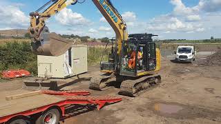 Loading excavator on to trailer [upl. by Yecnahc335]